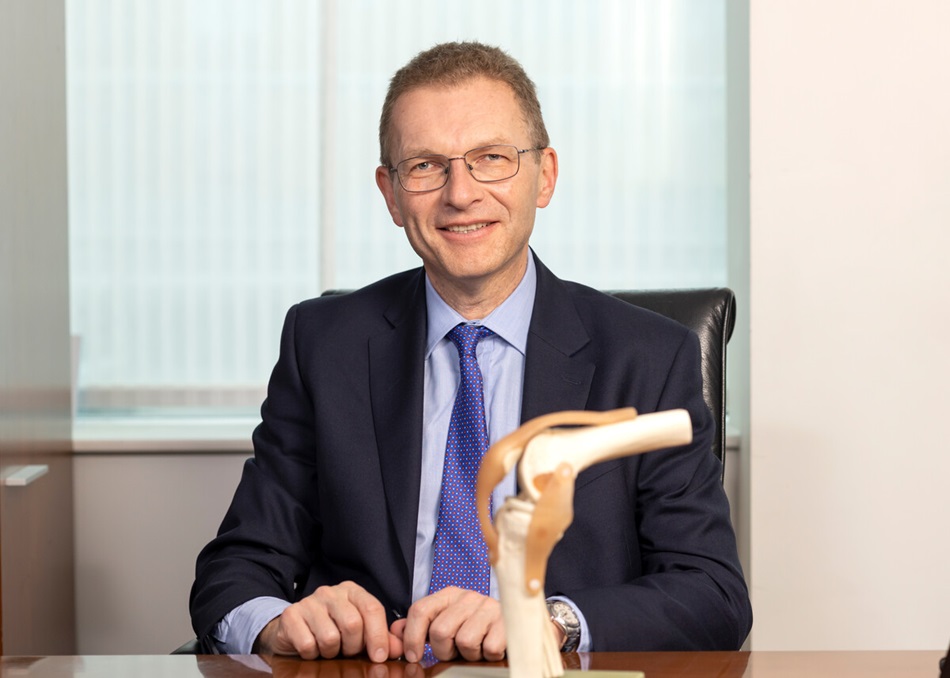 Mr Carrington at his desk